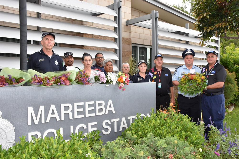 Officers and staff from the Tablelands Patrol Group received a wreath from Crime Stoppers Far Northern Volunteer Area Committee and are thanking the community for their support.