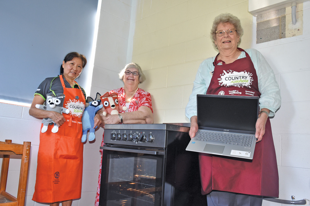 QCWA ladies Margery Jones, Lesley Mackeny and Diane Donaldson are excited to announce their new stove, laptop, fridge, freezer and vacuum to help with their country kitchen project.