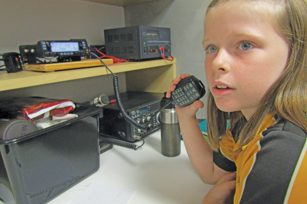 Ashlee Sculthorpe from Kairi State School learning how to use amateur radio.