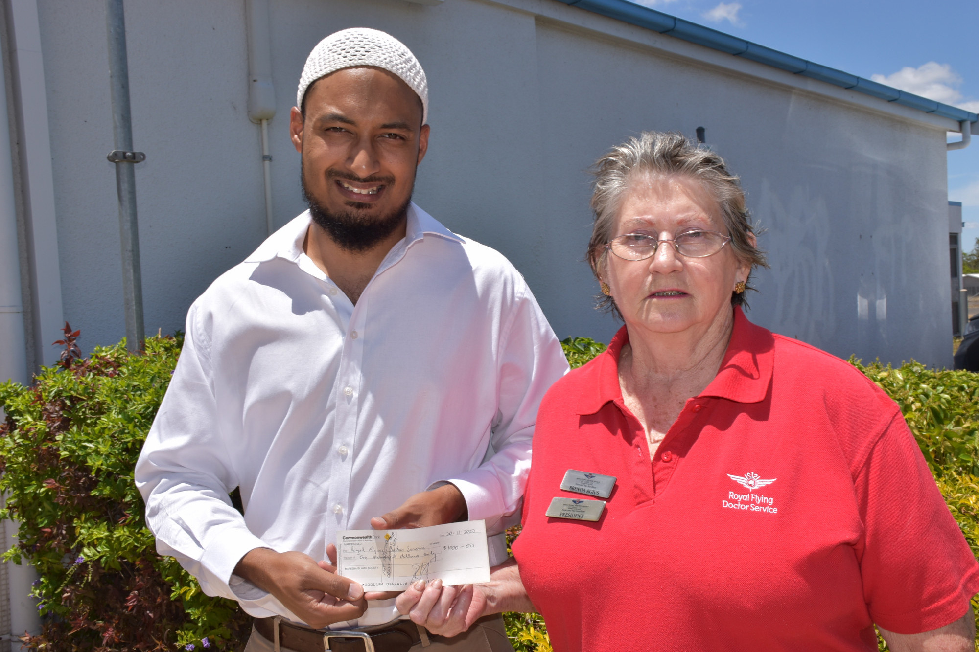 Dr Akil Islam from the Mareeba Islamic Society presenting a $1000 cheque to Royal Flying Doctor Service Near and Far Auxiliary President Brenda Agius.
