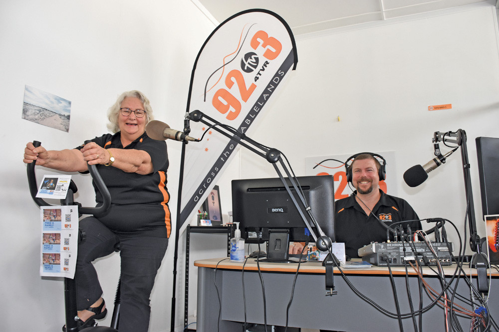 92.3FM secretary/interviewer Phyllis Pianta and station manager Ben Cooney are asking people to help them support Ride for Compassion this year by riding some kilometres on their exercise bike