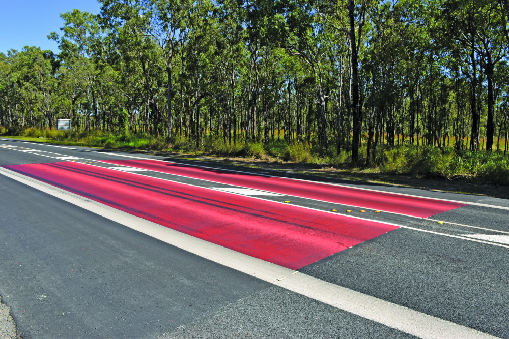 Entry points into Mareeba have recently been painted over in a distinctive red paint as a part of new Township Entry Treatment, informing drivers to slow down when entering town