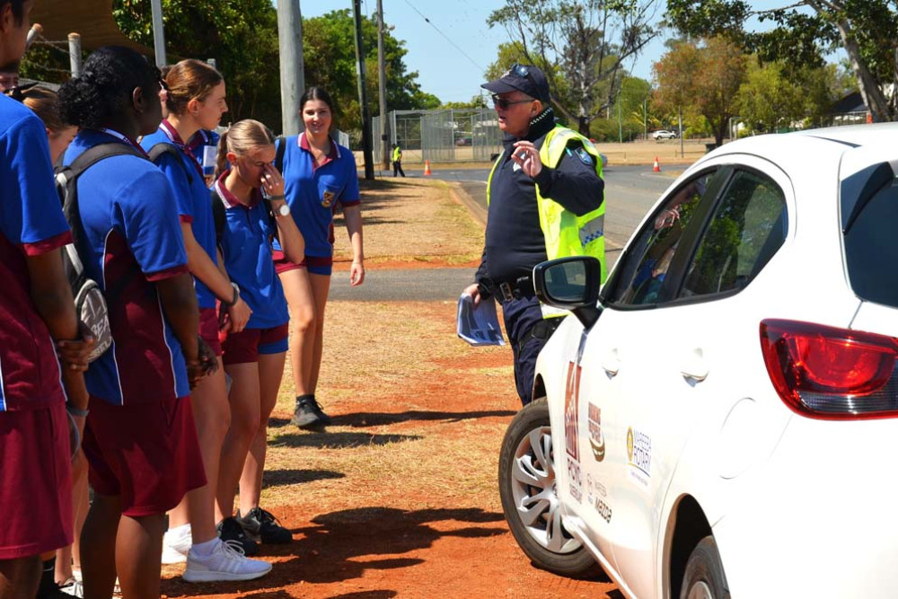 Mareeba State High School students learning about car safety at the RYDA program.