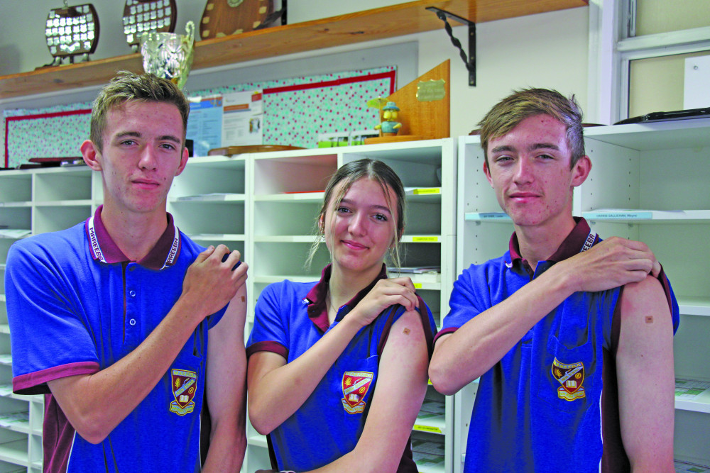 Joey, Summer and Josh Srhoj all rolled up their sleeves last Friday to receive their first dose of the Moderna COVID vaccine at Mareeba State High School.