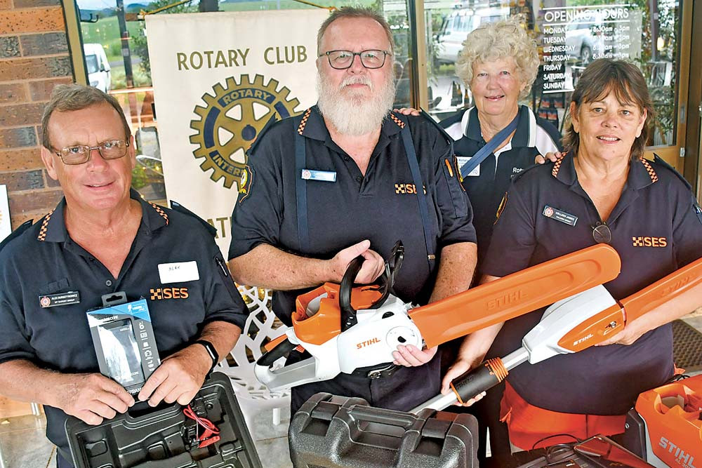 Alex Bursztynowicz of Mount Garnet SES (left), John Whyte from Atherton SES, and Colleen James of Malanda SES (right) with Atherton Rotary president Leigh Woltmann with the items purchased with the donation.