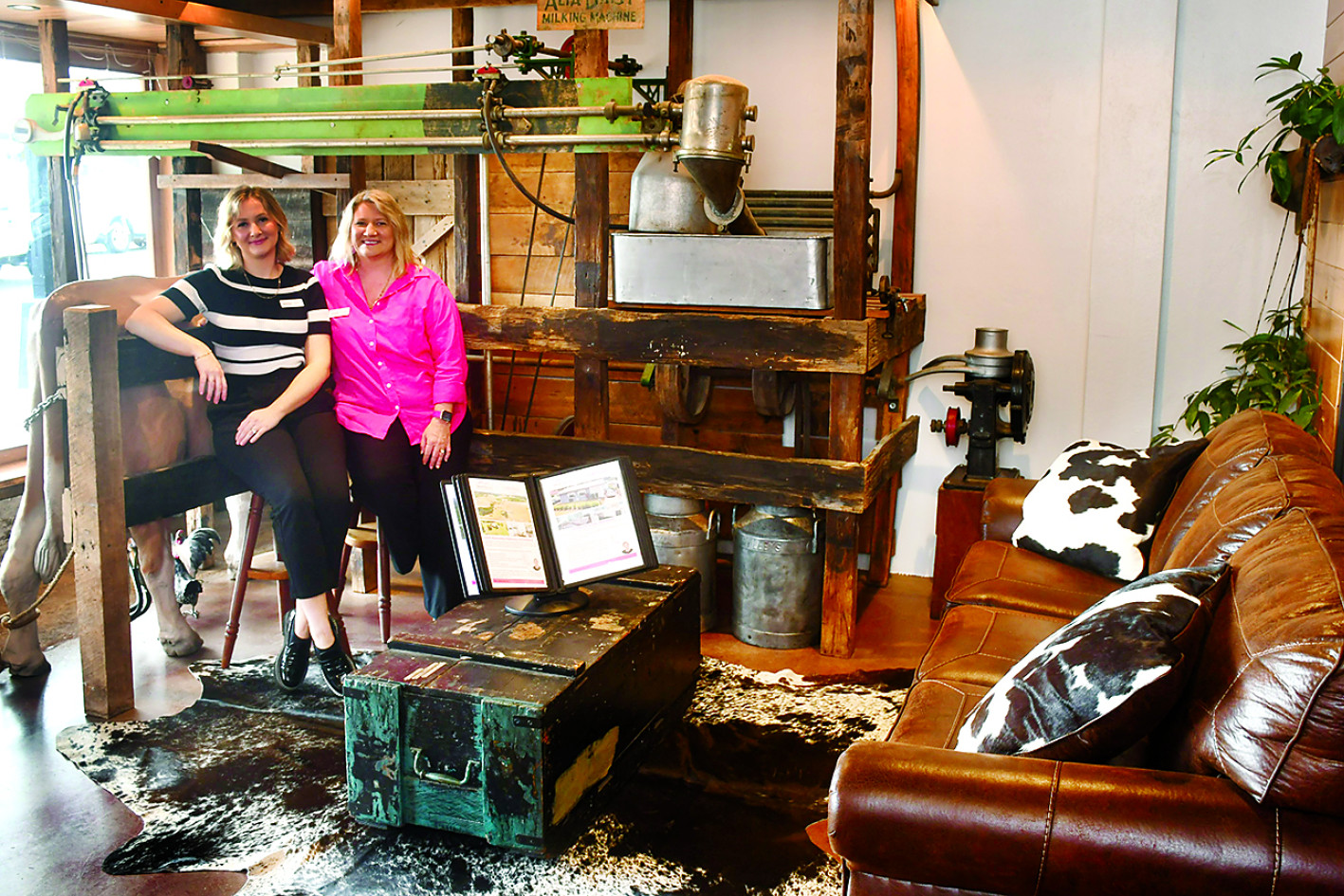 INSIDE: Shellie Nightingale and her daughter, Sasha, in their new business premises which features a variety of vintage equipment from the dairy and timber cutting industries, while the desks, front counter and other furniture have been made from reused timber.