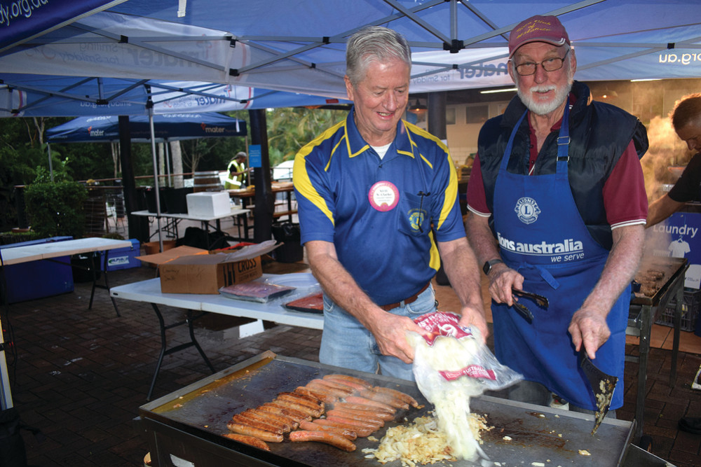 Cooking up a storm for the hungry bike riders were (left) Atherton Lions president Neil Clarke and Ray Sutton from Malanda Lions Club.