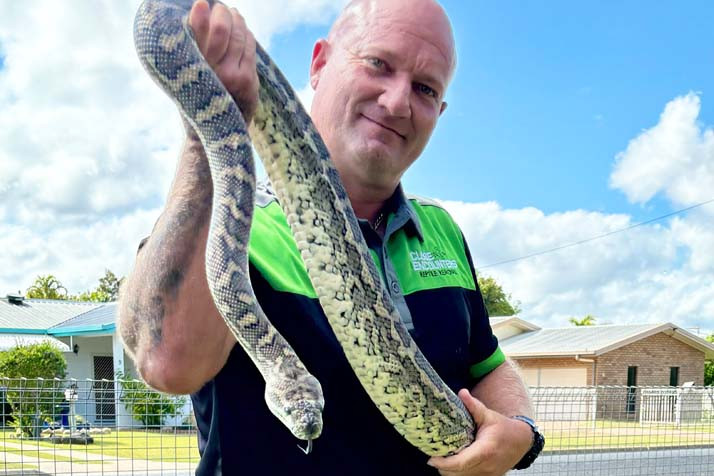 Jay holding one of his pet pythons.