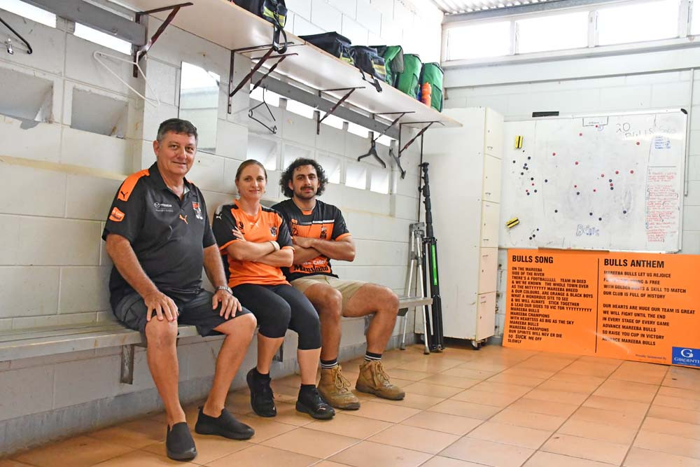 Mareeba United Football club members Mario Ghensi and Tyson Tatti with treasurer Giulie Alderton in the change rooms set to be upgraded.