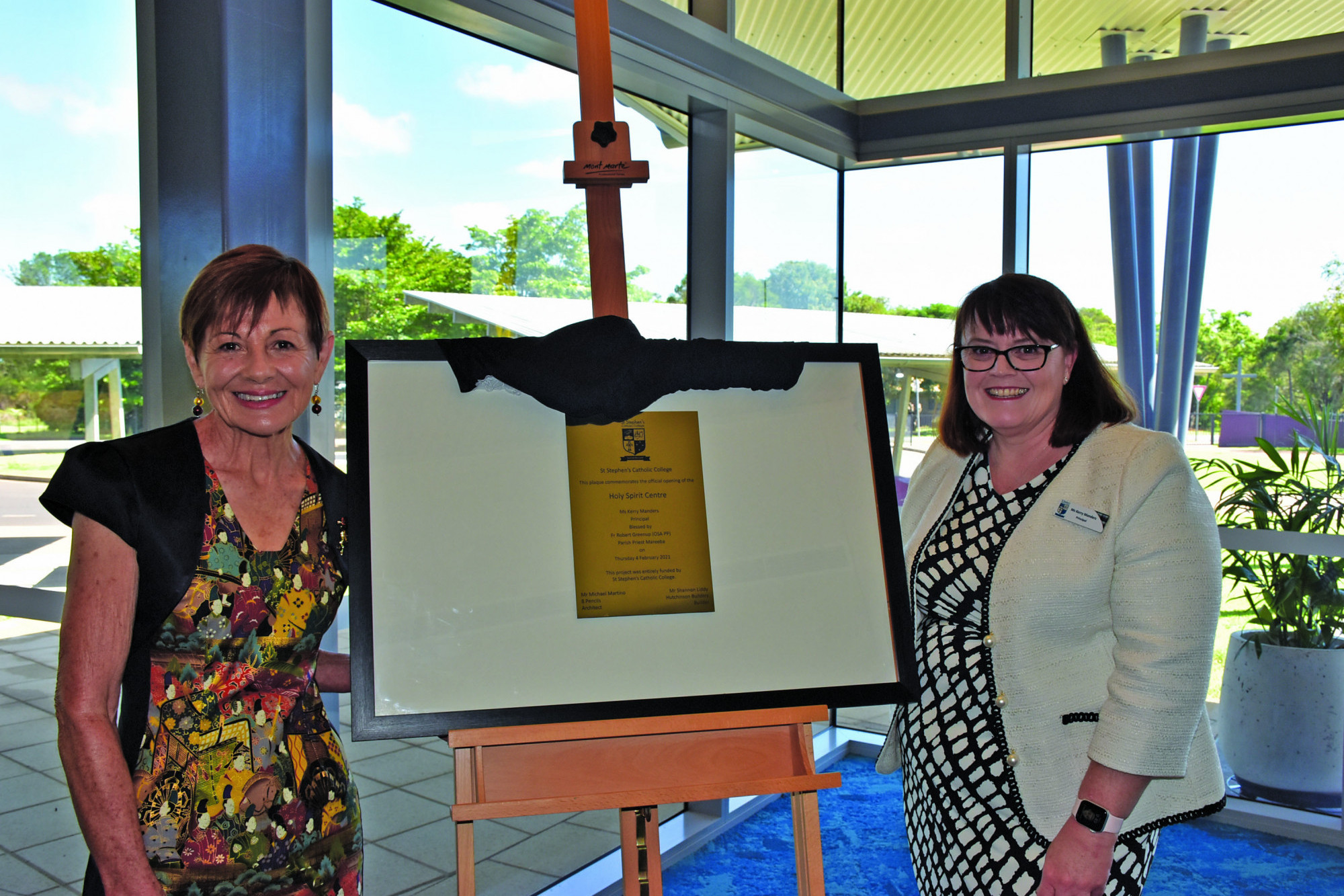 Past St Stephen’s Catholic College Principal Ida Pinese and current Principal Kerry Manders with the commemorative plaque of The Holy Spirit Centre that was officially opened last Thursday.