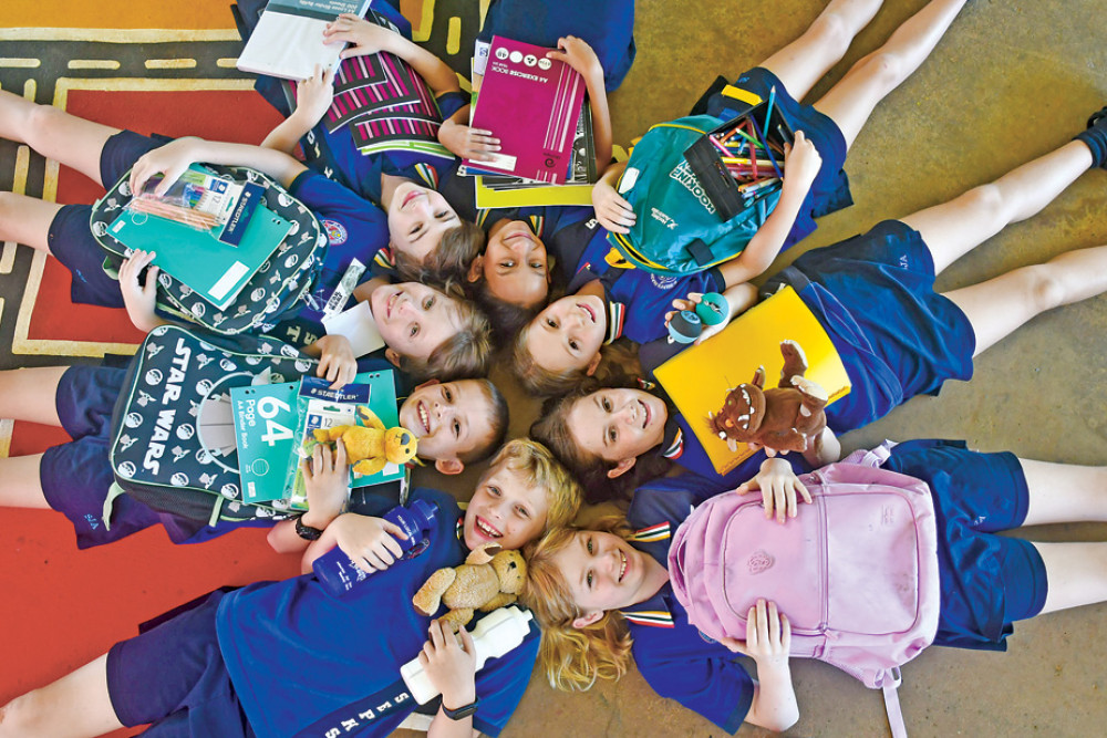 Grade 5 students (from bottom left clockwise) Finley Atkinson, Orran Foster, Buster McArthur, Carter Cole, Isabela Valle, Layla Wallace, Georgia Field and Summer Wadley with donated school supplies