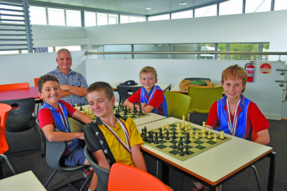 Chest Coach Michael Harnischfegar with St Thomas’ Chess team players Sami Abdalla, Ashley King, Christian Salvetti and Rodney Perkowicz who took out second place in a Queensland Chess Championship in Brisbane recently.