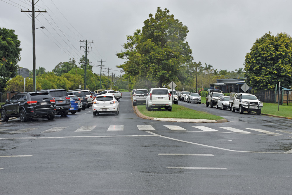 Congestion and no free car parks causes cars to park on the middle strip of Hastie Street next to St Thomas' School in Mareeba where the new drop off zone is slated to be constructed