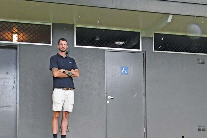 Lake Tinaroo Holiday Park park manager Joshua McLean at the disabled toilet block on the foreshore, which people with mobility issues cannot access.