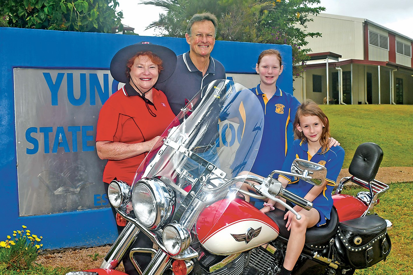 Many motorcycles and cars will feature in this year’s Tablelands Toy Run including this 1996 Kawasaki Vulcan, belonging to Errol Brix. Pictured ready for the run are Jan Delai from the Salvation Army, toy run coordinator Don Sheppard and Yungaburra School students Farrah and Allerak Bolger.