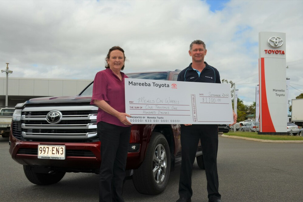Mareeba Meals on Wheels president Patricia Goldfinch receiving a $1,100 donation from Mareeba Toyota Sales manager Andrew Ford.