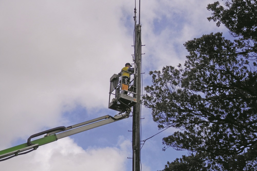 One of the new UHF-CB repeaters being installed at Millaa Millaa.