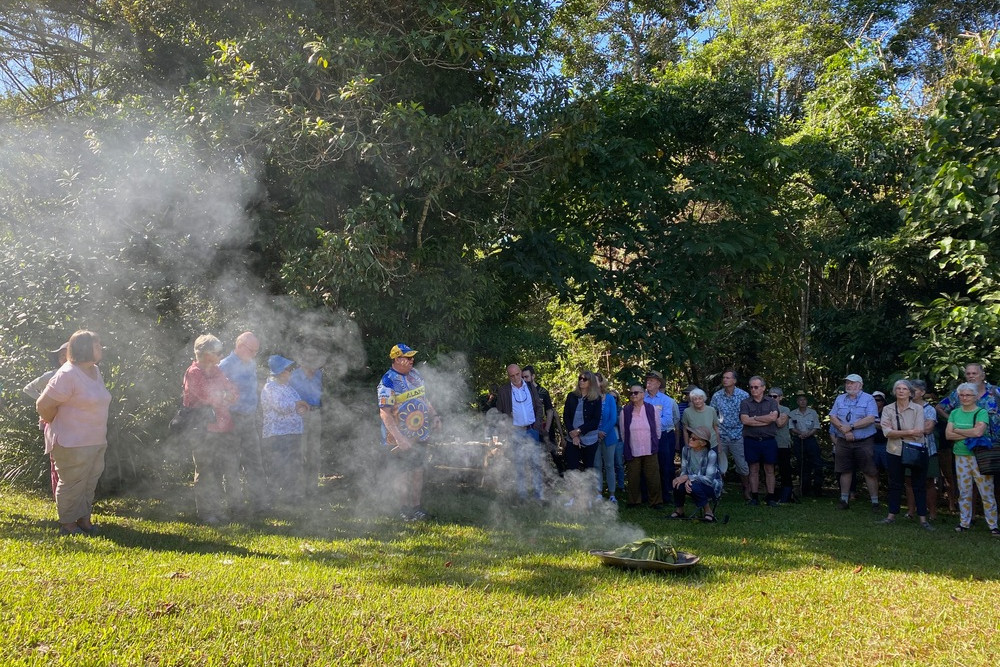 A smoking ceremony was done by Warren Canendo to welcome people to Country as they acknowledged the traditional owners, the Ngadjon-ji to celebrate 40 years of rainforest care.