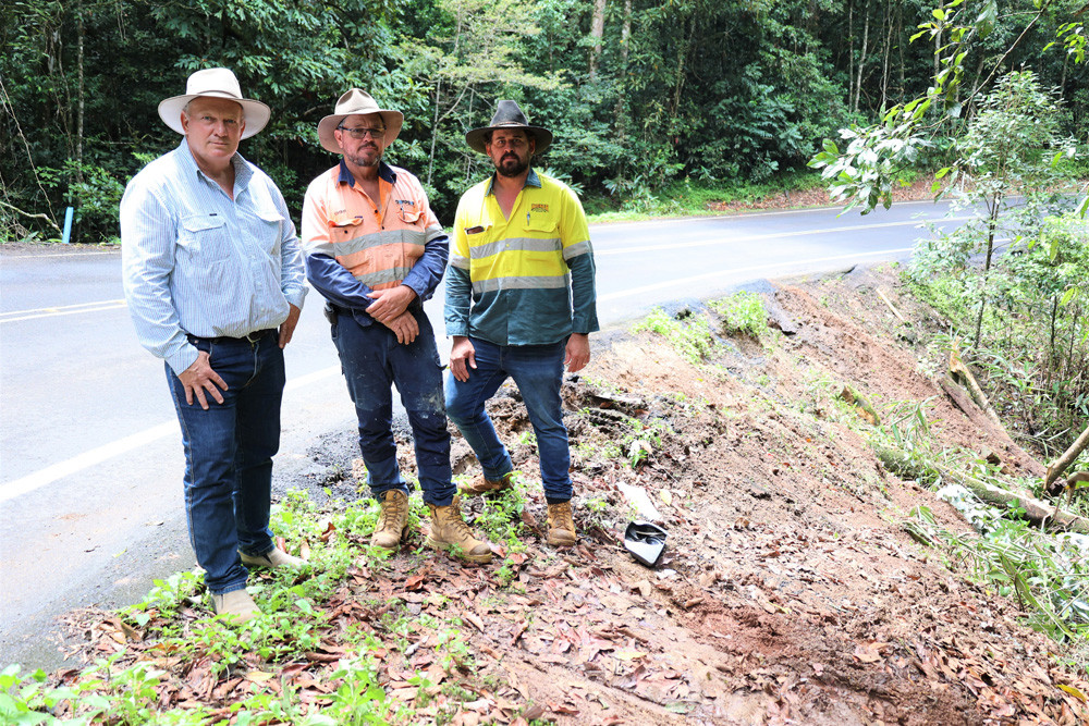 ACTION NEEDED: State Member for Hill Shane Knuth, Dempsey Cranes and Construction owner Chris Dempsey and Ravenshoe Chamber of Commerce vice president Blake Kidner inspecting the damage after a truck rolled down an embankment on the Kennedy Highway in February.
