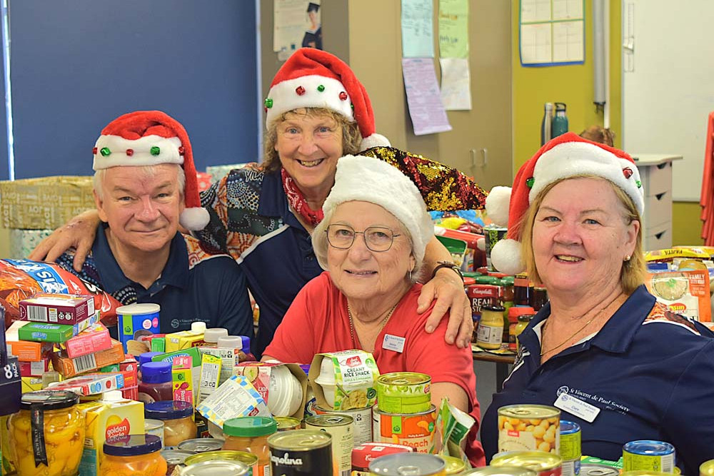 St Vincent de Paul Society members Deacon Peter de Hass (left), Brez, Veronica and Clare packed 35 hampers for the Mareeba community.