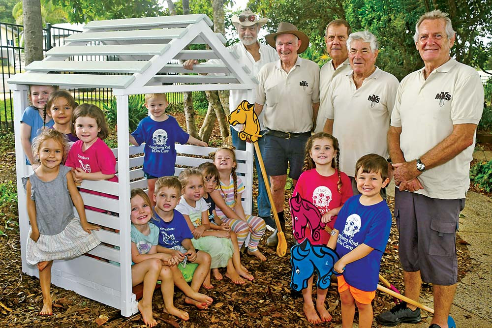 PICTURED: Members of the Yungaburra Men’s Shed delivered a handmade cubby house and some hobby horses to children at the local kindergarten.