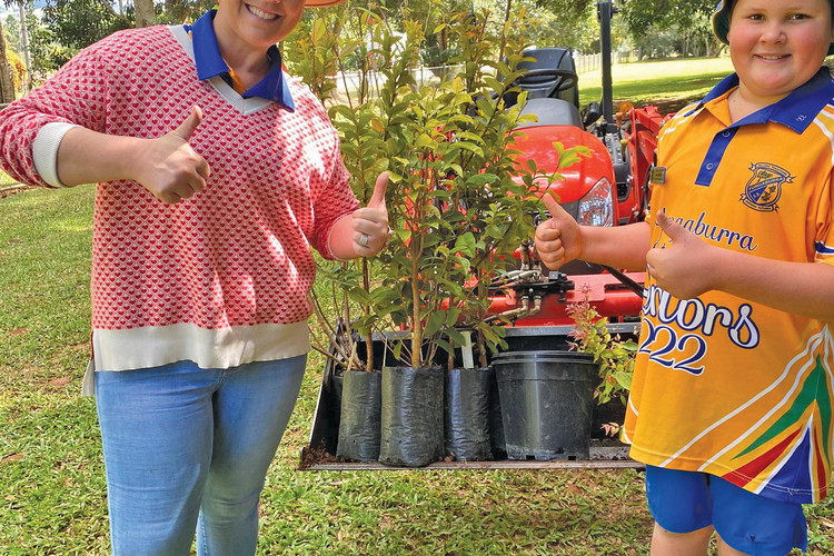 Yungaburra State School principal Jo McDougall and environmental leader Joey Donald with their new plants.