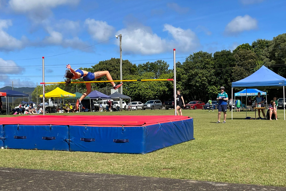 Elizabeth Horne (16 years) from Townsville North Star, clearing 1.50m at high jump.