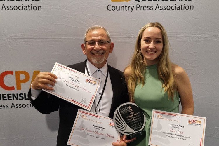 The Express managing director Carl Portella and cadet journalist Ellie Fink receiving four awards at the 2023 QCPA awards