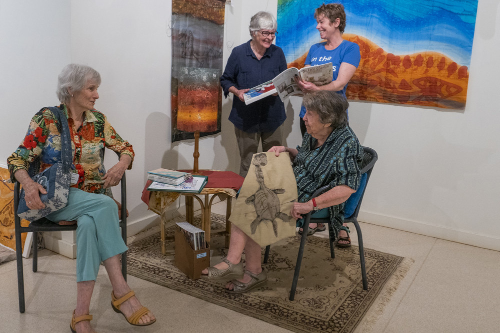 Artists Olga Kaptein, Marion Clarkson, Kate Eden and Sandra Burchill (sitting) take a break during the exhibition installation. PHOTO: Alison Faigniez
