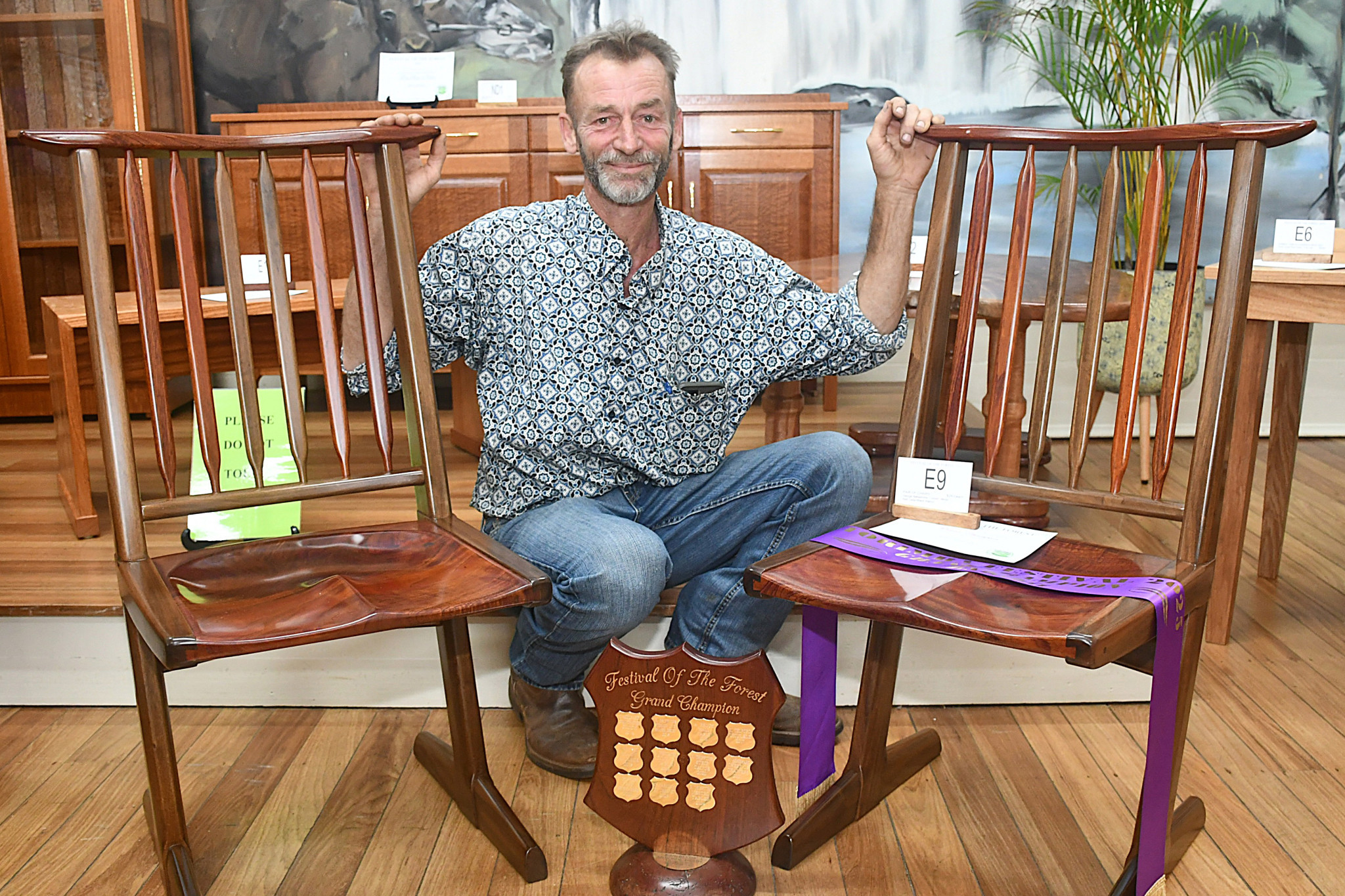 Tarzali’s Adriaan Vanderveen won Grand Champion Exhibit with his pair of chairs made from red cedar and black walnut.