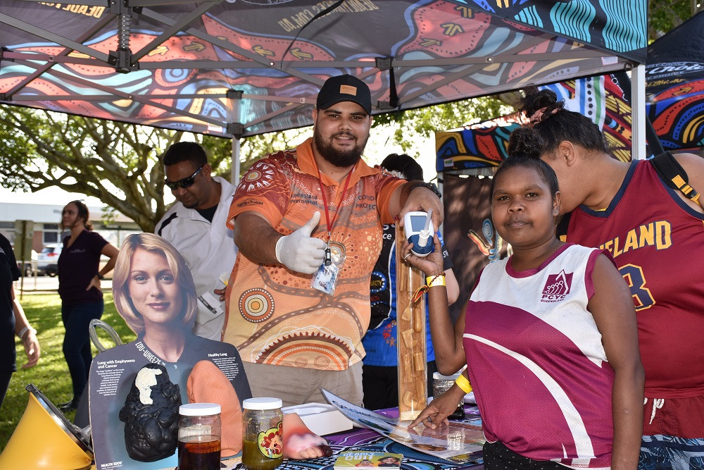 Errol Leon informing Josephine Douglas about the dangers of smoking at the recent Mulungu No Tobacco Day event.