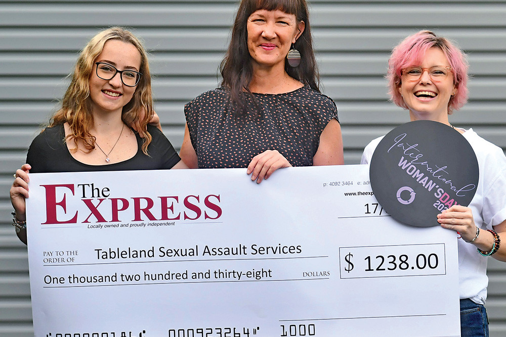 The Express cadet journalist Ellie Fink and office manager Kat Child (pictured) presented Tracey (centre) from TSAS the cheque last Friday.
