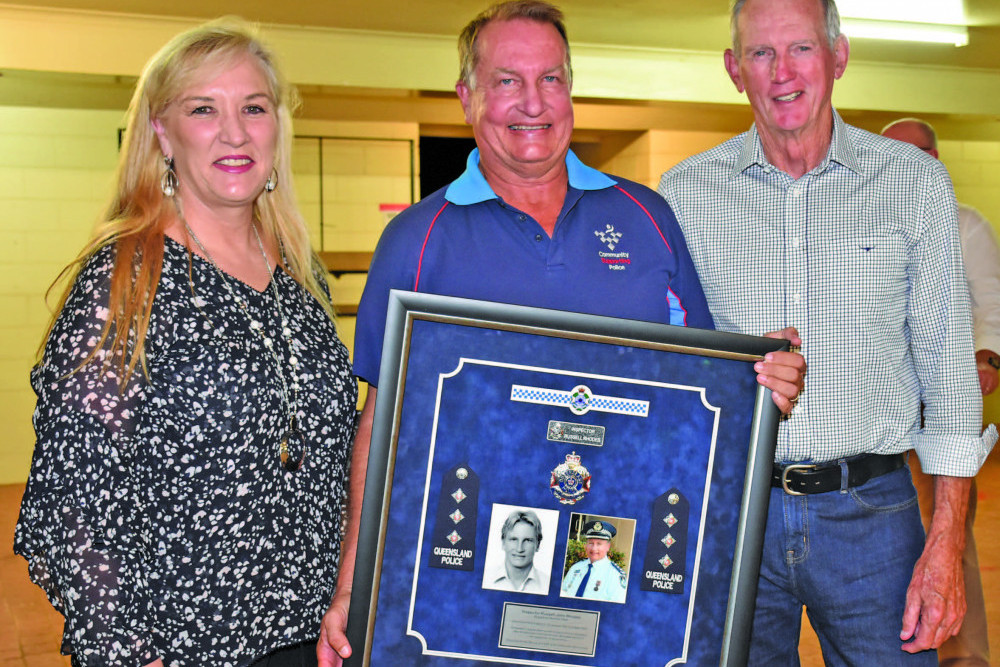 Queensland Police Commissioner Katarina Carroll with former Inspector Russell Rhodes and star rugby league coach Wayne Bennett at the retirement celebration on Saturday night in Mareeba.