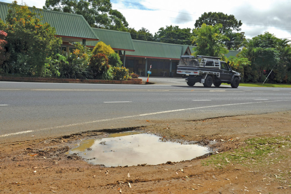 The verge of the Kennedy Highway where trucks pull up to get coffee at Mareeba is causing dust and mud problems.