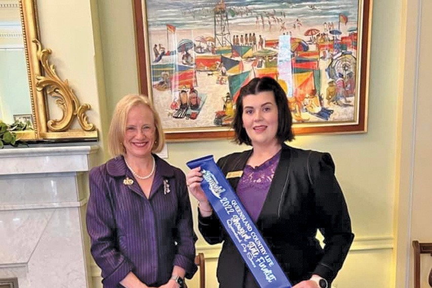 Queensland Governor Jeanette Young presents Caitlin with her state finalist sash.