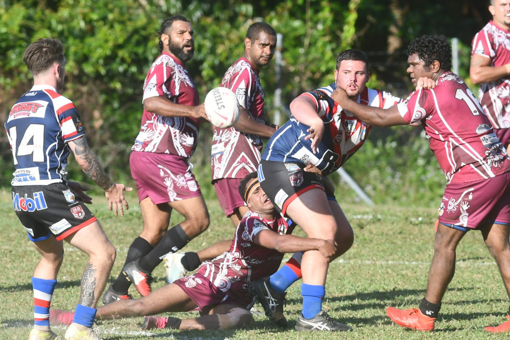 Roosters prop James Coyle gets the ball away at Yarrabah on Sunday afternoon