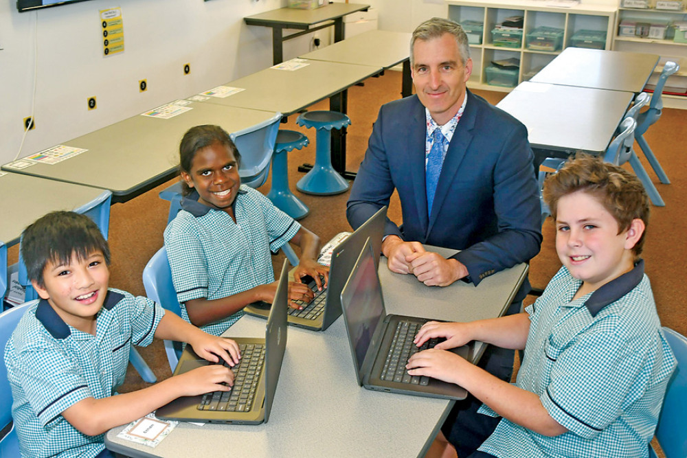 Jubilee Christian College students Elijah Barlaan, Nevaeh Mangurra and William Craperi with Dr Chris Radcliffe (principal) preparing for NAPLAN 2023