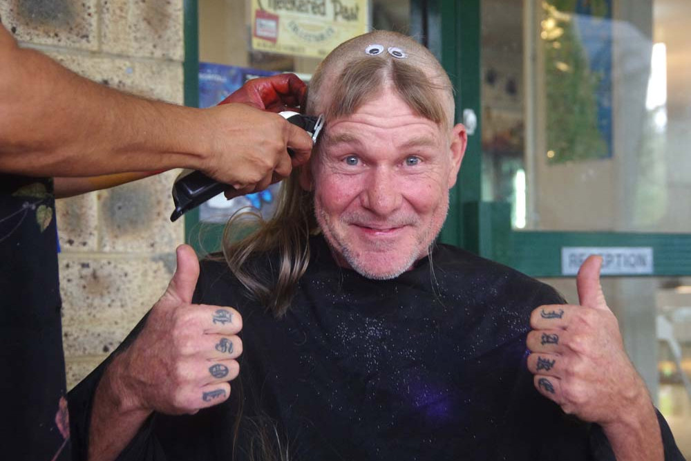 Going, going, gone! Ken Bell enthusiastically endorsed his support for “Shave for a Cure”.