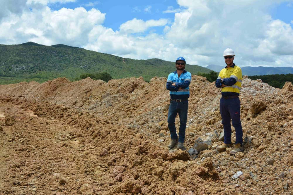 Standing on top of the dust protection bund wall at Mt Carbine Tungsten Mine is production manager Brad Goodwin and operations manager Ryan MacNeill.