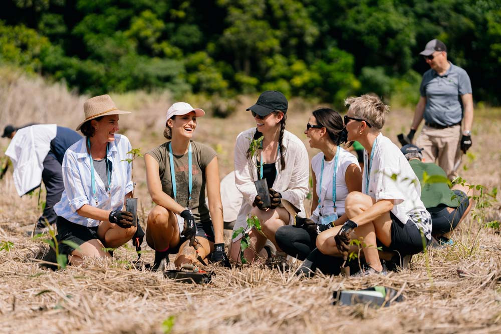 Tourism Tropical North Queensland’s (from left) Tara Bennett, Corrinne Singleton, Kirsty Boase, Brittany Nash and Harriet Ganfield joined the Reforest planting day helping to restore tree kangaroo habitat.