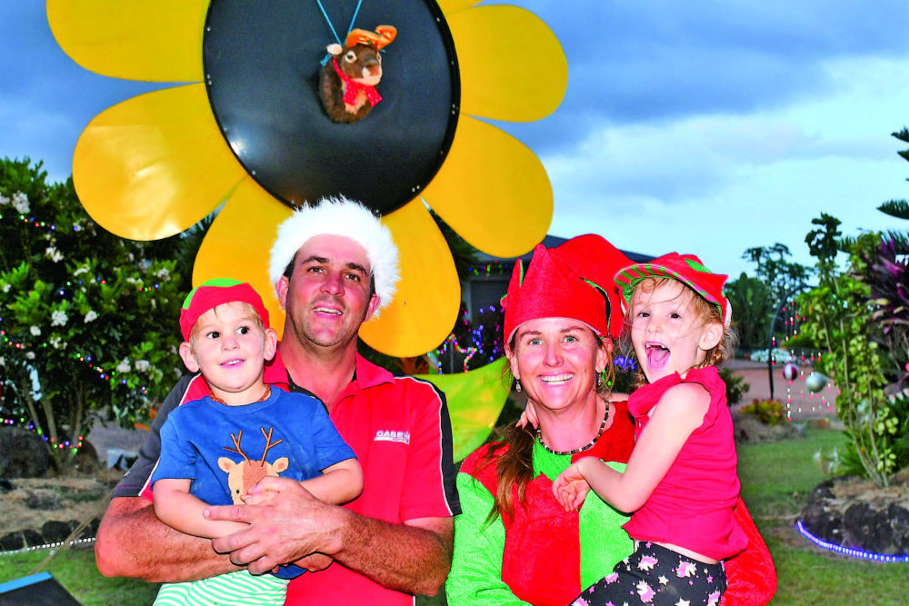 Winners of the Tablelands Regional Council Christmas Lights competition, the Trimarchi family have been busy making sure their property spreads some good cheer this festive season. Pictured at their property at 46-76 Tate Road, Tolga are Anthony holding Ryan and his wife Samantha holding daughter Elyse.