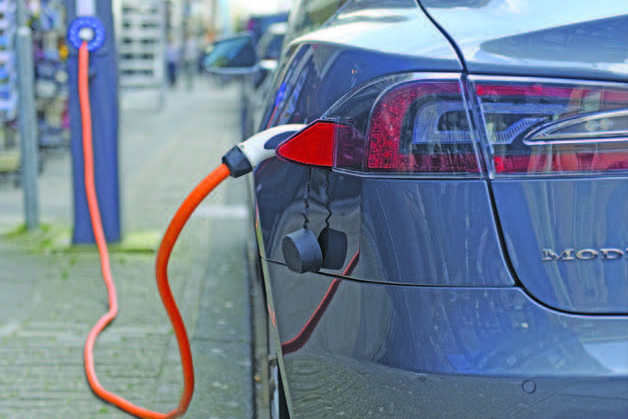 Electric vehicles such as Tesla can be charged at charging points in the community or at home.