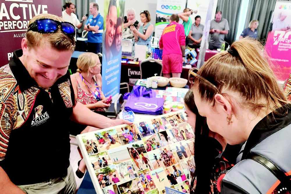 NDIS Allied Health Provider speaking with a potential client at the inaugural Douglas Shire Services Expo.