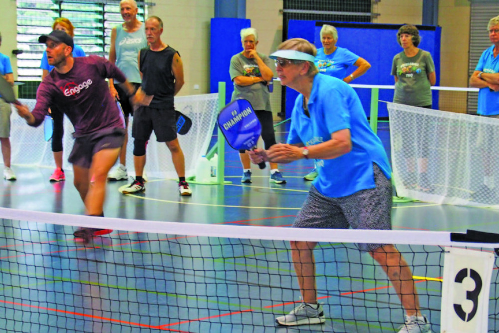 Brendan Lee demonstrating a small game drop shot supported by Frances Pelgrave. Photo by Cheryl O'Keefe.