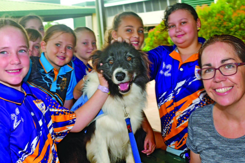 Tolga State School Students Pippa, Sienna, Shayla, Finlay, Mila, Jada and Celeste with Jolene Kattenberg and their support dog Kelso