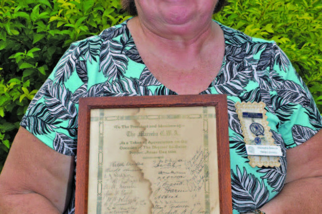 Helen holds the special thank you letter signed by all the servicemen from Mareeba who served in the First World War.