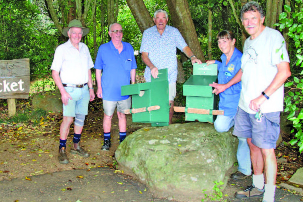 Men’s Shed members (from left) Martin Williams, Terry McCarthy, Kevin Mackenzie and Terry Kehoe with Wildlife Rescue representative Cathie Archer and the new possum boxes.