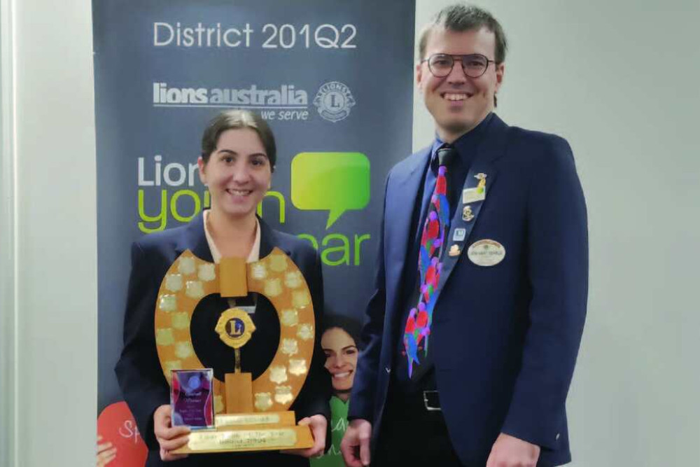 Alannah Falvo with Lions Club Tablelands Zone Chairman Gary Searle after her big win at the District Final for Lions Youth of the Year.