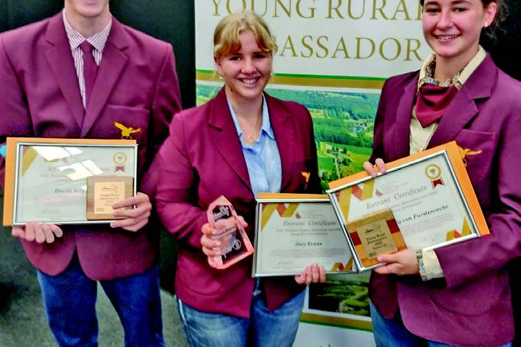 Atherton State High School 2022 Cairns Show Young Rural Ambassador Jacy Evans (centre) with joint second place David Kilpatrick and Sascha Micola von Furstenrecht.