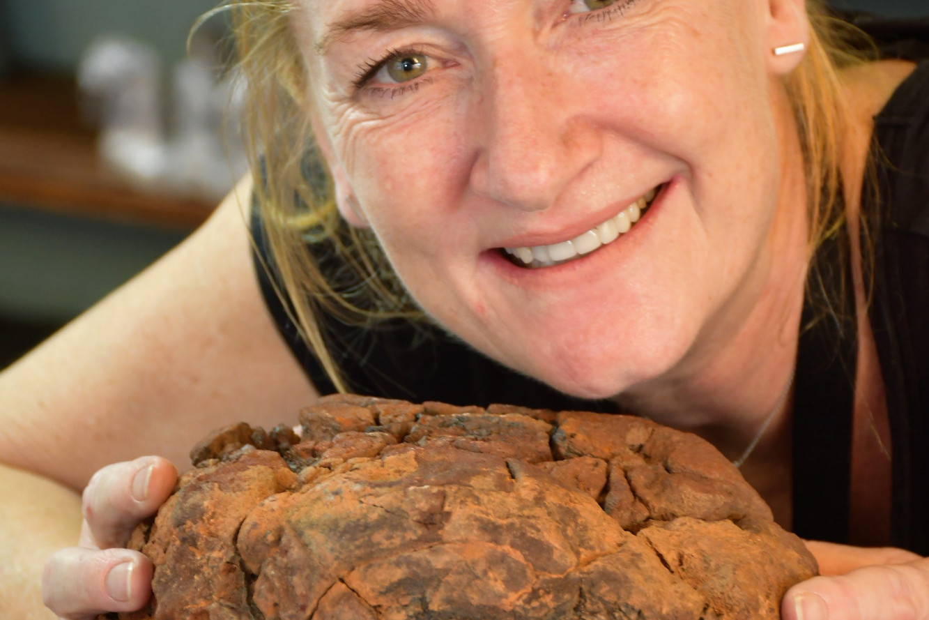 Crystal Caves manager Celilia Boissevain with the 4 billion year old meteorite.